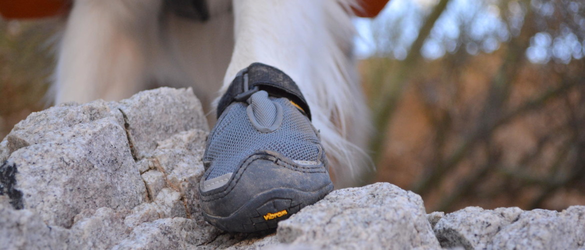 a close up of the Vibram® out-sole working on some pretty ruff rocks.